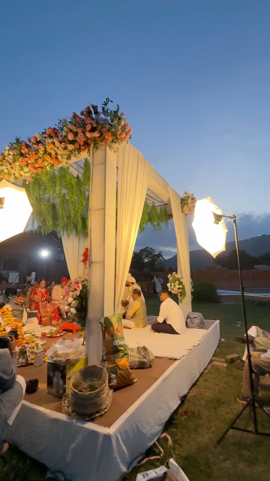 Floral wedding mandap at blue hour at The Udaisarovar lakeside venue Udaipur